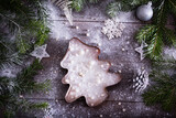 Christmas cake in the form of a Christmas tree on a wooden background, top view. Holiday concept, christmas, new year
