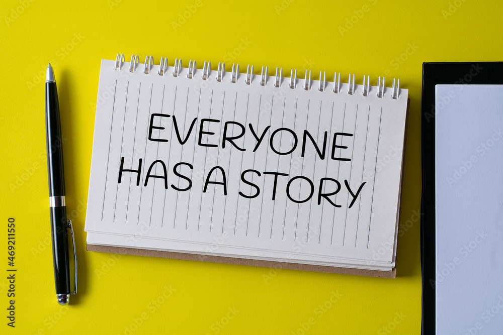 EVERYONE HAS A STORY written in a notebook - business concept. EVERYONE HAS A STORY written in a notebook - business concept.