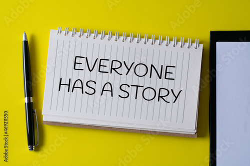 EVERYONE HAS A STORY written in a notebook - business concept.