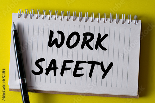 Word writing text WORK SAFETY in a notebook. Business concept.