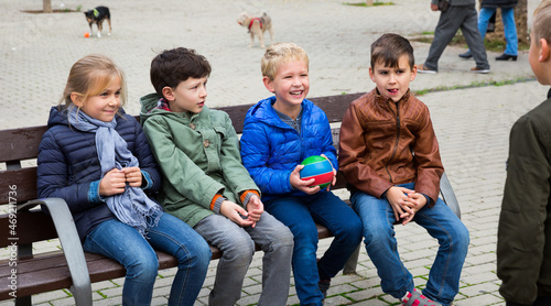 Children playing with small ball outdoor. High quality photo