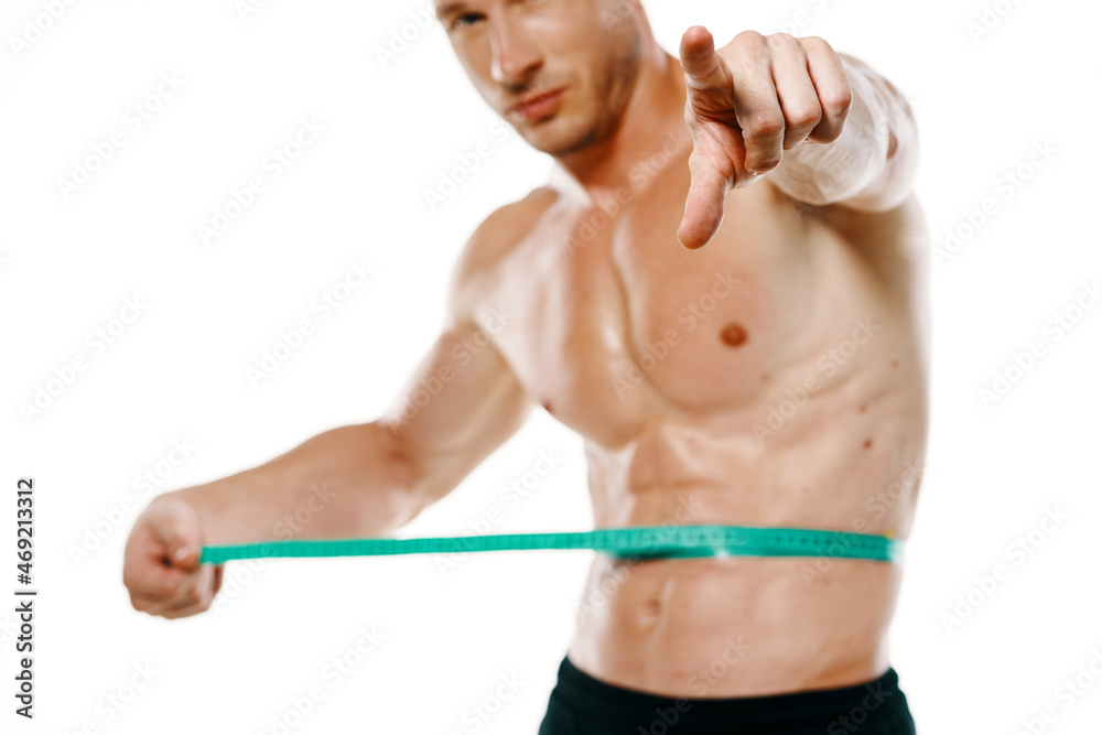 athletic man with measuring tape muscle workout