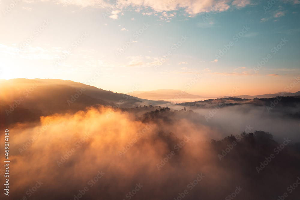 Flying above the clouds sunrise and fog