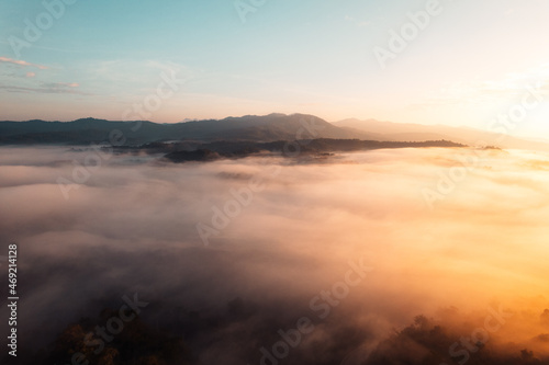 Flying above the clouds sunrise and fog