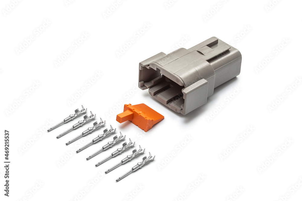 Connector for wiring. Spare part of the engine electrical system. Contact electrical connector isolated on white background Connector for wiring. Spare part of the engine electrical system. Contact electrical connector isolated on white background