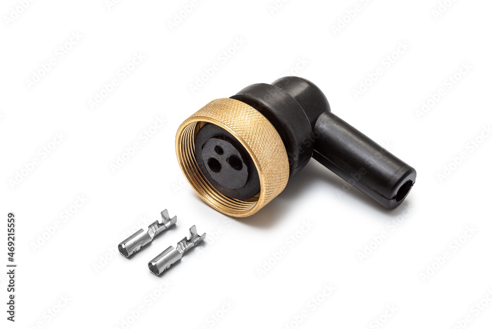 Connector for wiring. Spare part of the engine electrical system. Contact electrical connector isolated on white background Connector for wiring. Spare part of the engine electrical system. Contact electrical connector isolated on white background