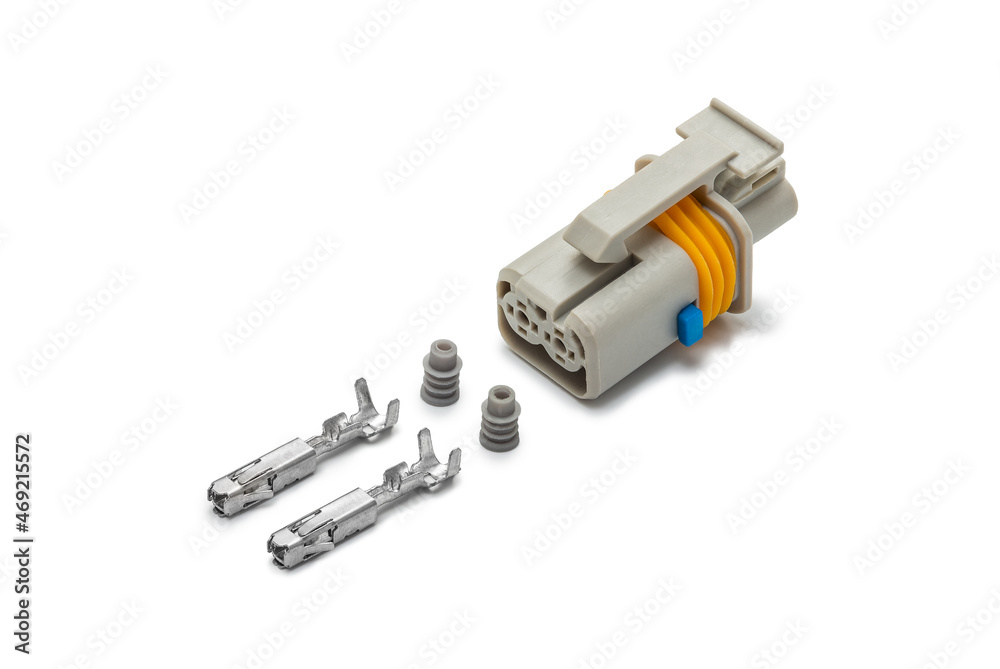 Connector for wiring. Spare part of the engine electrical system. Contact electrical connector isolated on white background Connector for wiring. Spare part of the engine electrical system. Contact electrical connector isolated on white background