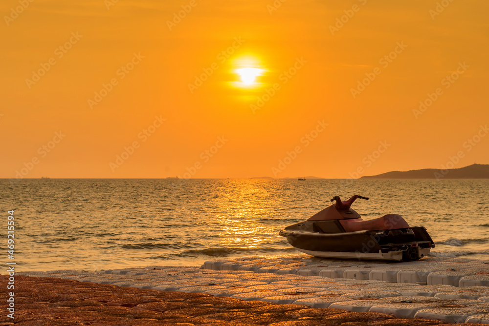 Jet ski parked on a beach with beautiful landscape sunset Jet ski parked on a beach with beautiful landscape sunset