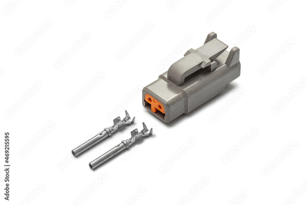 Connector for wiring. Spare part of the engine electrical system. Contact electrical connector isolated on white background Connector for wiring. Spare part of the engine electrical system. Contact electrical connector isolated on white background