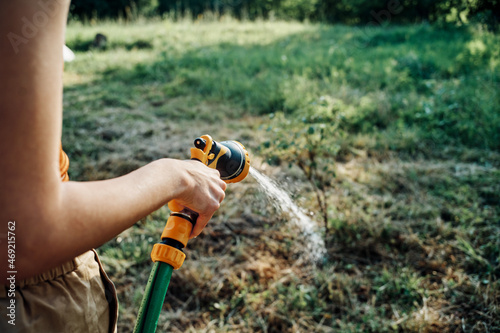 woman watering plants in the garden nature growing