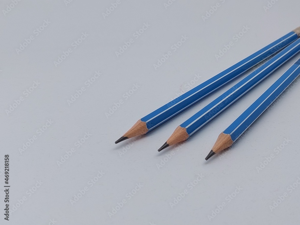 Close-up of blue pencils against white background Close-up of blue pencils against white background