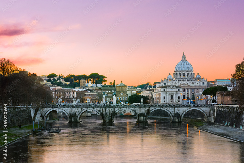 Fototapeta premium Sunset lights of the basilica St Peter in Rome, Italy
