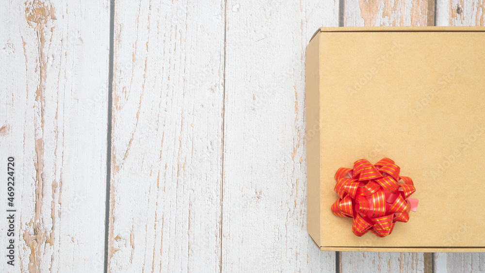 Gift box red ribbon on old wood top view copy space Gift box red ribbon on old wood top view copy space