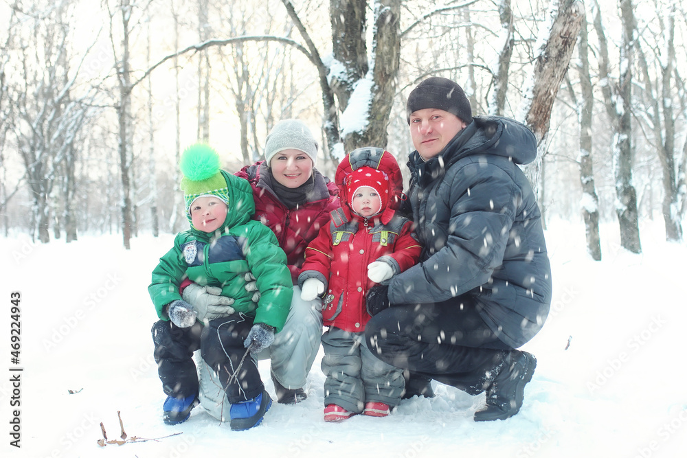 Young family in winter park