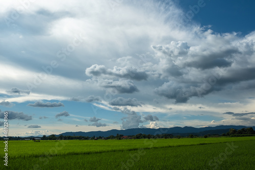 The white clouds have a strange shape and moutain.The sky and the open space have mountains below.Clouds floating above the mountains.