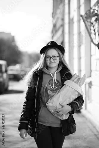 Black and white photo of a young girl on a walk © alexkich