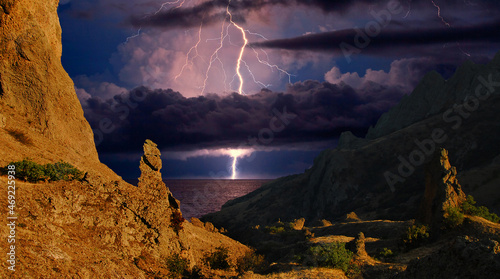 Lightning over the rocks of Karadag. Black Sea Coast, Eastern Crimea. Stunning landscape of a storm in the mountains, with lightning and flashes