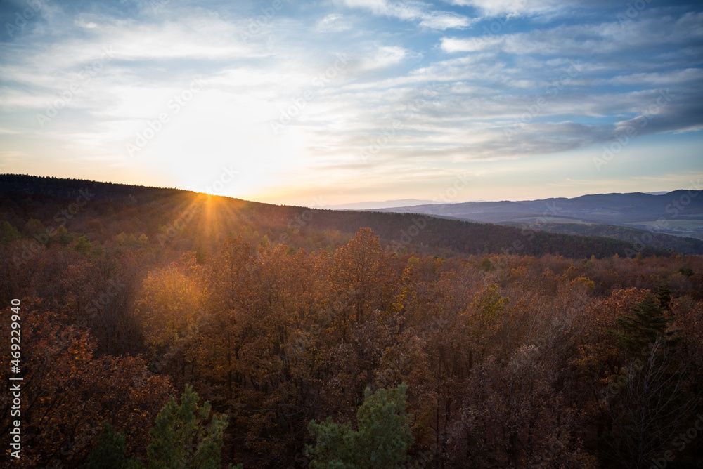 Autumn sunset over landscape and forest