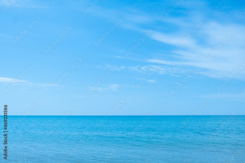 Ocean beauty. Nature scenery. Peaceful harmony. Azure glaze of calm water surface and blue sky in sunny daylight.