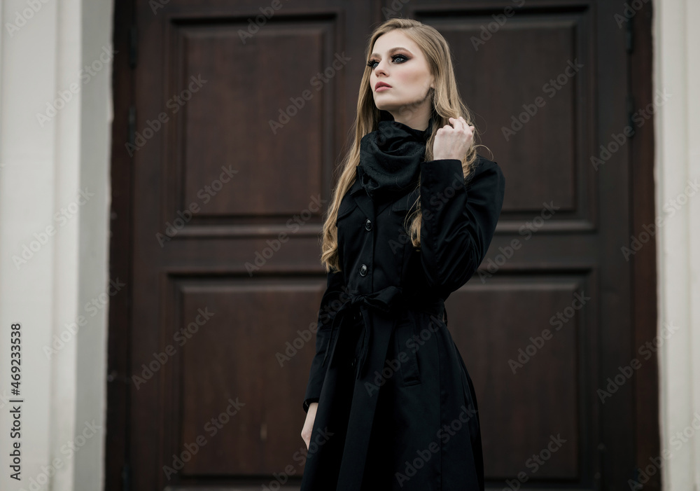 woman wearing elegant black coat woman wearing elegant black coat