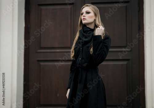 woman wearing elegant black coat © jozzeppe777