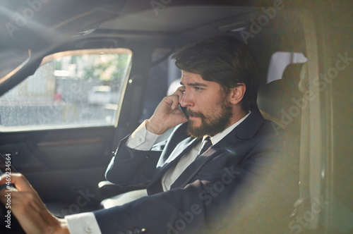 bearded man official passenger driver road communication by phone © SHOTPRIME STUDIO