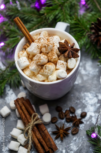 Hot chocolate with marshmallows, a warm cozy Christmas drink on a gray background. Christmas hot chocolate with marshmallow. 