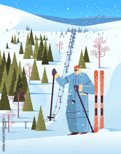 skier man sportswoman skiing doing activities winter vacation concept snowfall landscape background