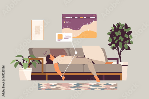 young woman sleeping on sofa with electronic smart watch app tracker on hand quality and quantity sleep control