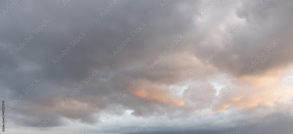 Scenic cumulus clouds on the sky, sunrise in the mountains in winter, atmosphere background