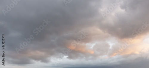 Scenic cumulus clouds on the sky, sunrise in the mountains in winter, atmosphere background