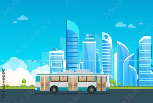Trolleybus riding on road at megapolis cityscape. Electric public transport ride with skyscrapers