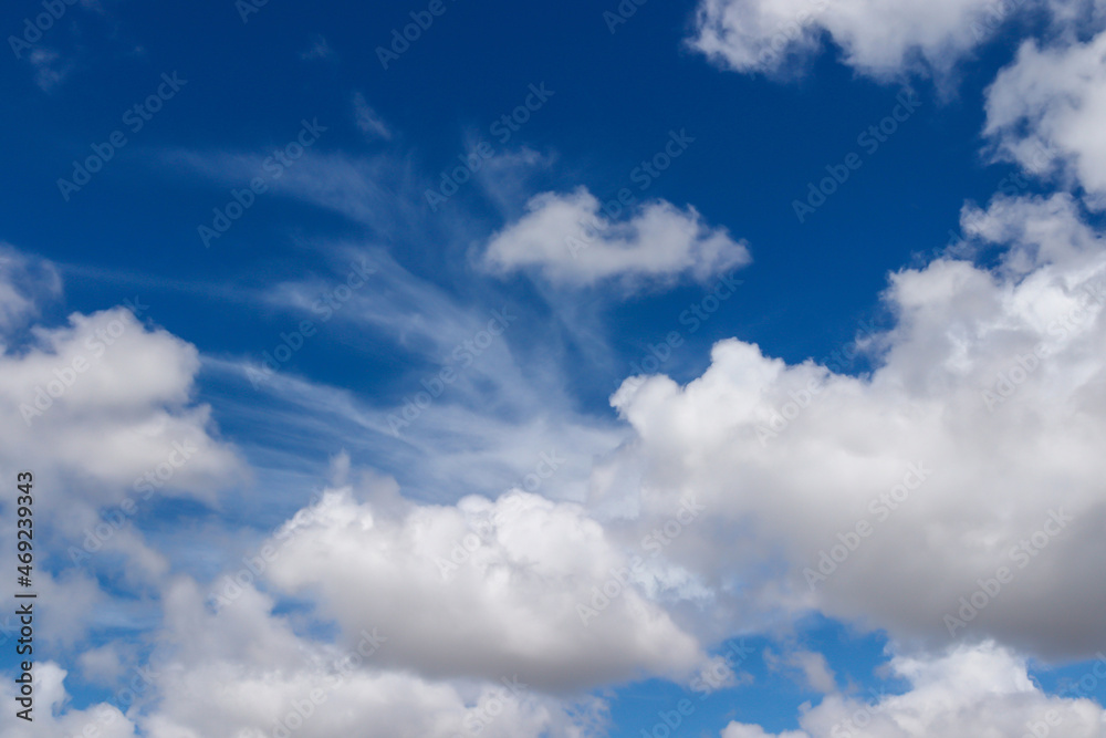 A group of white cumulus clouds in the blue sky background. The shape of the independent nature. A group of white cumulus clouds in the blue sky background. The shape of the independent nature.