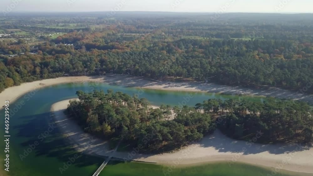 Aerial drone view of the beautiful small island in the middle of the lake in the tropical paradise looked in the Netherlands, Europe. Aerial drone view of the beautiful small island in the middle of the lake in the tropical paradise looked in the Netherlands, Europe.