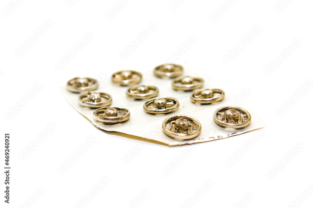 Steel buttons on white background with selective focus Steel buttons on white background with selective focus