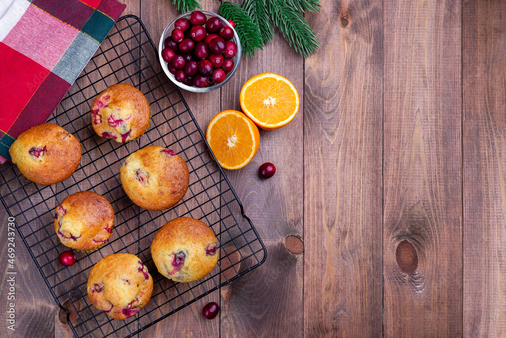 Cranberry orange muffins on cooling rack, horizontal, top view, copy space, Christmas decoration
