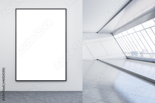 Modern concrete interior with mock up banner on empty wall, panoramic window with city view and daylight. Minimalism concept. 3D Rendering.