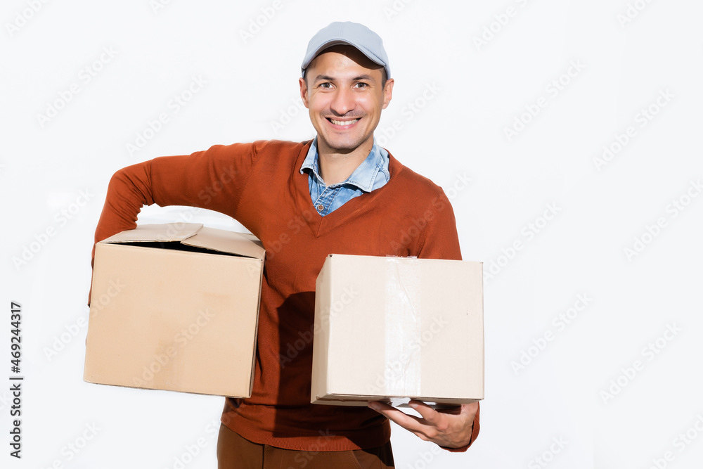 Smiling delivery man giving cardbox on white background Smiling delivery man giving cardbox on white background