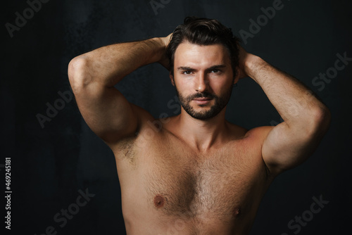 Young half-naked man posing and looking at camera © Drobot Dean