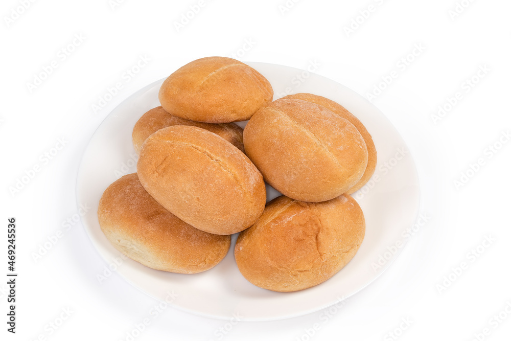 Pile of small buns on white dish on white background
