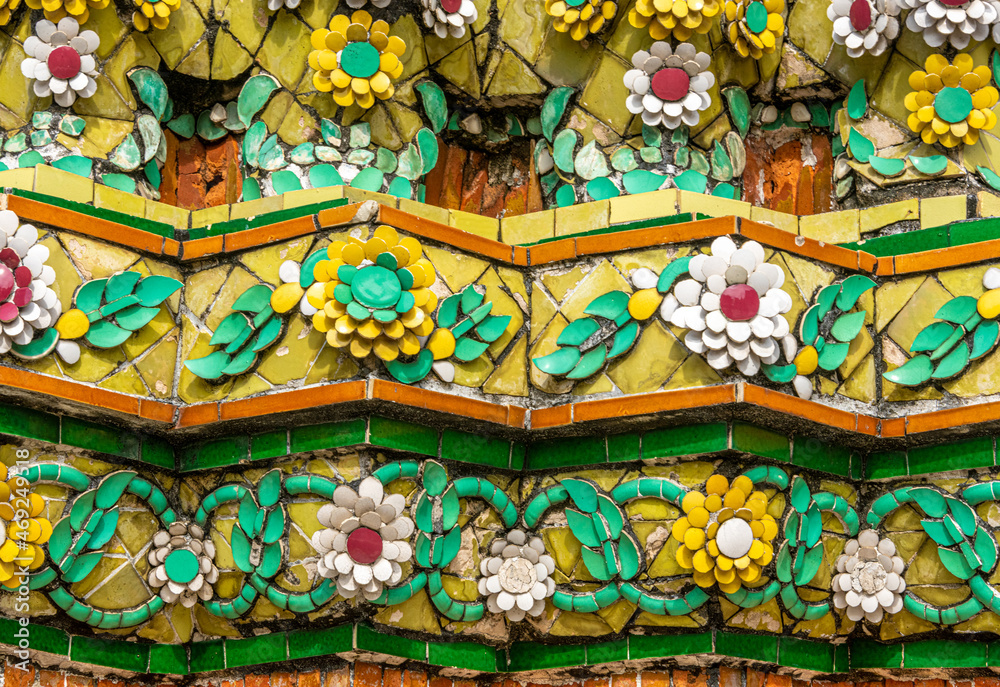 Flower and tile details on a stupa at Wat Pho Temple in Bangkok