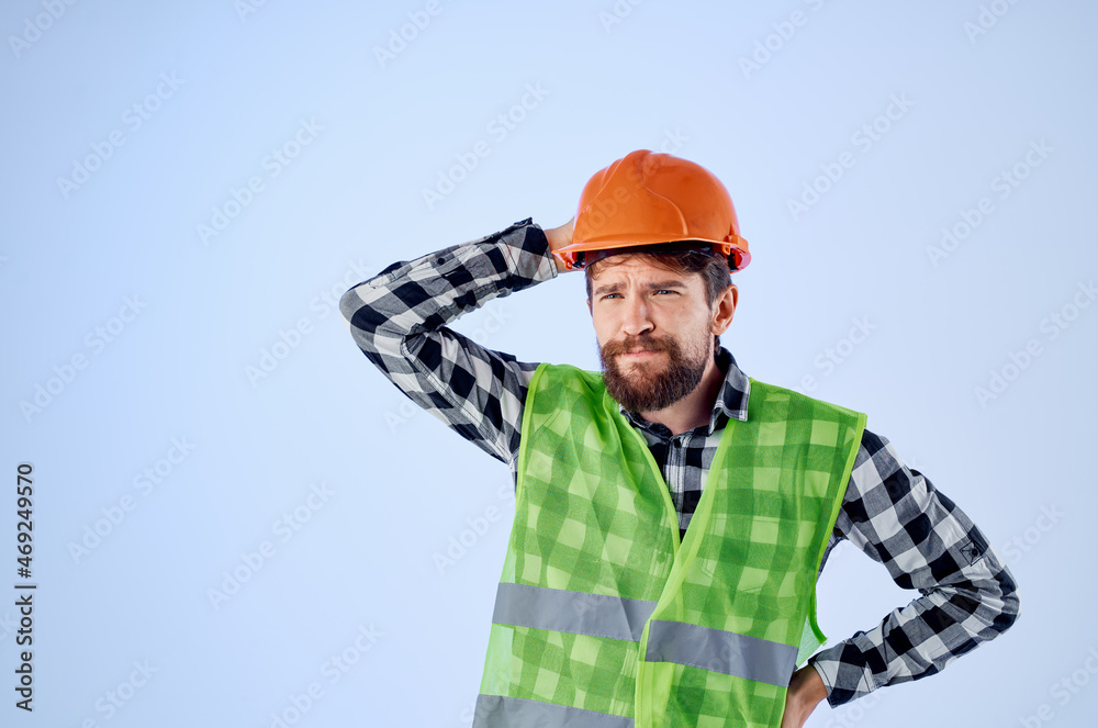 emotional man green vest orange helmet workflow hand gestures blue background emotional man green vest orange helmet workflow hand gestures blue background