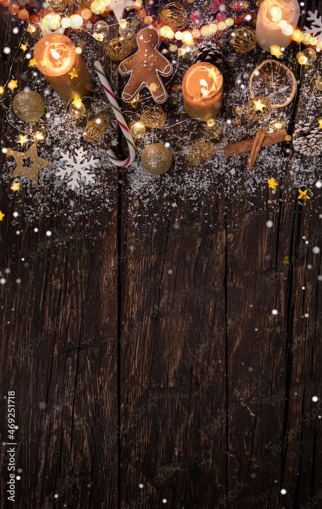 Naklejka premium Christmas decoration on wooden background, lots of copy space for product or text.