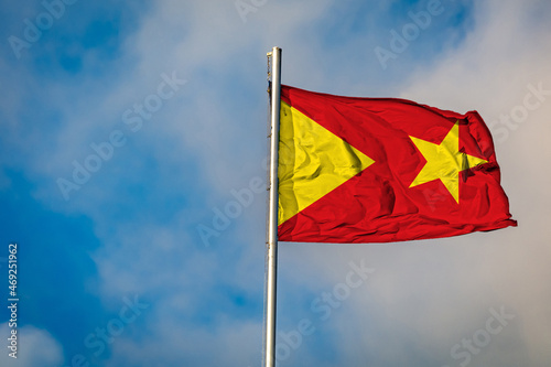 A Flag of the Tigrey Region in Ethiopia flying on a Flagpole against the Sky photo