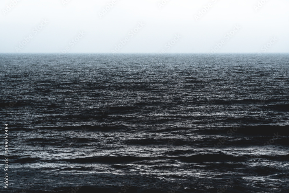 Texture of the cark blue silver shining ocean during storm in Spain Texture of the cark blue silver shining ocean during storm in Spain