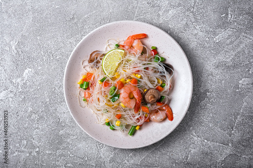 A traditional dish of Asian cuisine. Japanese noodles with shrimps, shiitake mushrooms and vegetables