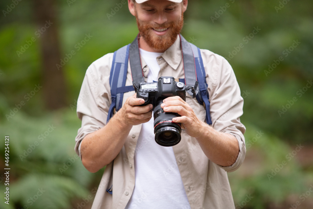 happy photographer looking at camera happy photographer looking at camera