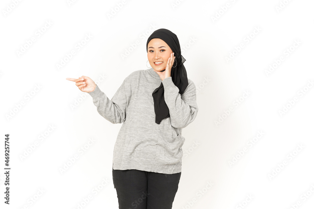 Pointing aside of Beautiful Asian Woman Wearing Hijab Isolated On White Background Pointing aside of Beautiful Asian Woman Wearing Hijab Isolated On White Background