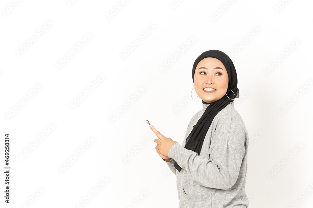 Smile and Using Smartphone of Beautiful Asian Woman Wearing Hijab Isolated On White Background Smile and Using Smartphone of Beautiful Asian Woman Wearing Hijab Isolated On White Background