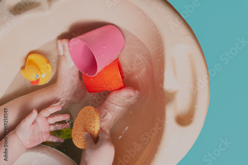 White caucasian Toddler taing a bath feet close up top view colorfull shot photo